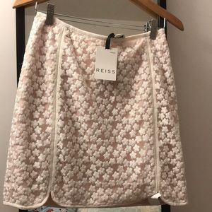Super chic REISS skirt with intricate flower art!